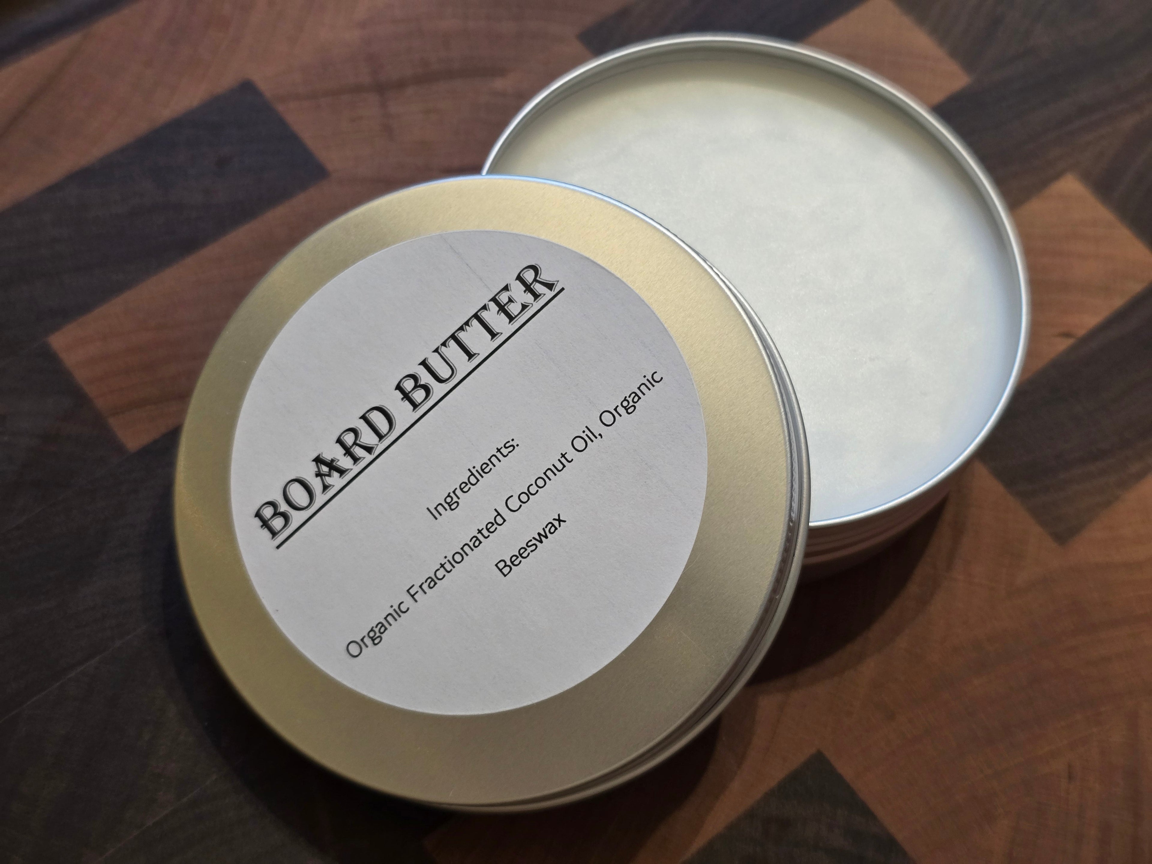 Board Butter cutting board conditioner in 2oz and 4oz sizes by ReDieming Creations, made with organic beeswax and fractionated coconut oil. Mineral oil free. Natural alternative to mineral oil.